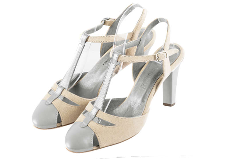 French elegance and refinement for these light silver and champagne white dress open back T-strap shoes, 
                available in many subtle leather and colour combinations. Its comfortable fit will accompany you until the end of the night.
Its charming, playful cutout gives you plenty of customization options.  
                Matching clutches for parties, ceremonies and weddings.   
                You can customize these shoes to perfectly match your tastes or needs, and have a unique model.  
                Choice of leathers, colours, knots and heels. 
                Wide range of materials and shades carefully chosen.  
                Rich collection of flat, low, mid and high heels.  
                Small and large shoe sizes